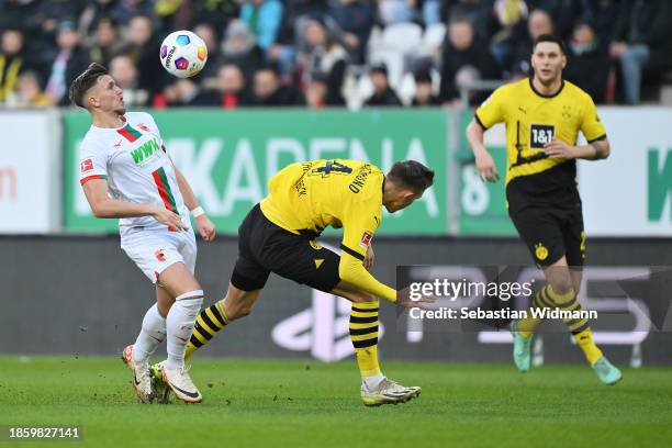 Ermedin Demirovic of FC Augsburg controls the ball against Nico Schlotterbeck of Borussia Dortmund during the Bundesliga match between FC Augsburg...