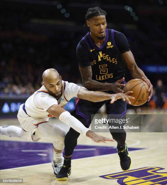 Los Angeles, CA New York Knicks Taj Gibson and Los Angeles Lakers Cam Reddish battle for a loose ball in second quarter action. Lakers vs Knicks at...