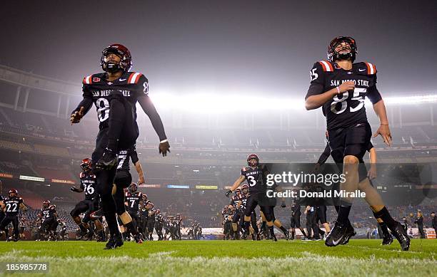 Members of San Diego State Aztecs warm-up before the start of their game against the Fresno State Bulldogs on October 26, 2013 at Qualcomm Stadium in...