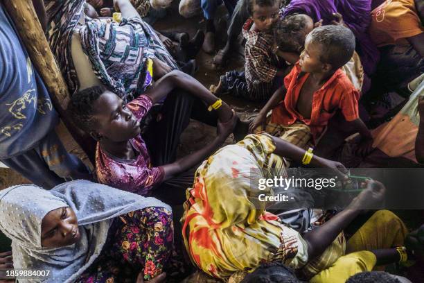 Civilians fleeing conflict in Sudan wait for asylum registration procedures at the United Nations High Commissioner, in Renk, South Sudan on December...