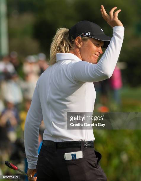 Suzann Pettersen raises her arm in celebration after putting on the 18th hole during day four of the Sunrise LPGA Taiwan Championship on October 27,...