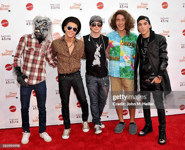 The recording group IM5 attends the Keep A Child Alive's 20th Annual Dream Haloween at the Barker Hangar on October 26, 2013 in Santa Monica,...