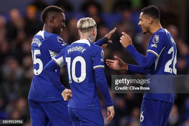 Nicolas Jackson of Chelsea celebrates after scoring their team's second goal with teammates Mykhaylo Mudryk and Levi Colwill during the Premier...