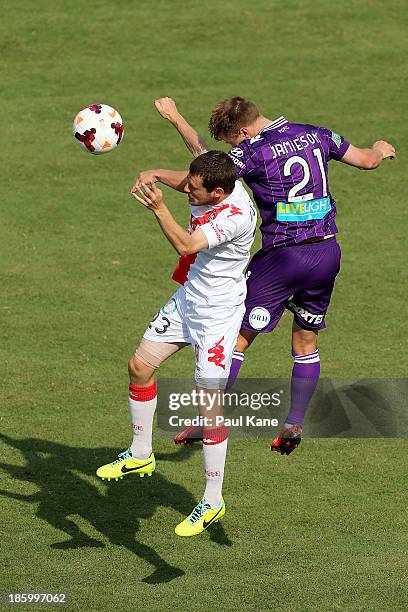 Mate Dugandzic of the Heart and Scott Jamieson of the Glory contest for the ball during the round three A-League match between Perth Glory and the...