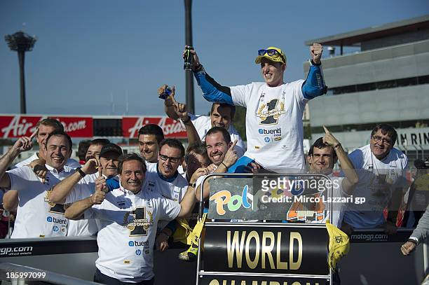 Pol Espargaro of Spain and Pons 40 HP Tuenti celebrates with his team after winning the Moto2 race to claim the 2013 Moto2 World Championship title...
