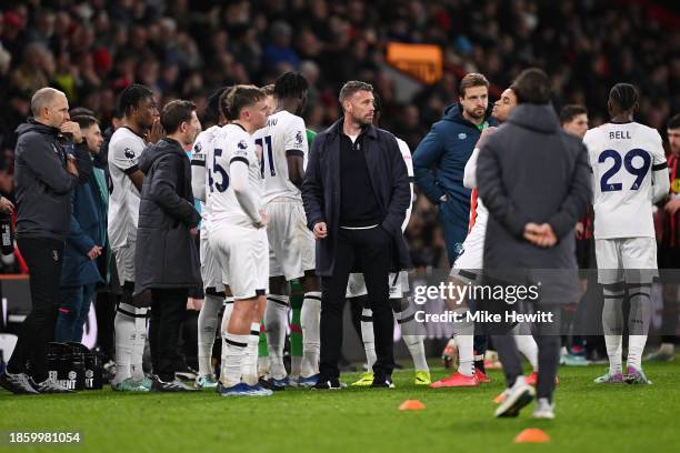 Rob Edwards, Manager of Luton Town, and players of Luton Town react as a break in play takes place as Tom Lockyer of Luton Town receives medical...