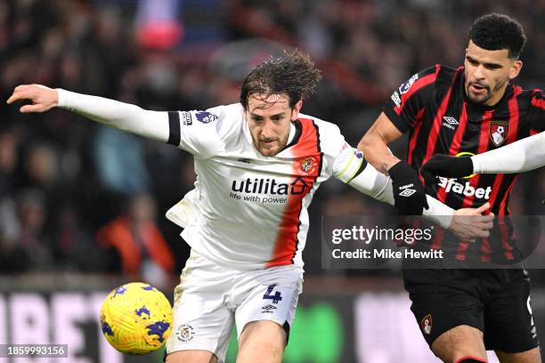 Tom Lockyer of Luton Town controls the ball whilst under pressure from Dominic Solanke of AFC Bournemouth during the Premier League match between AFC...