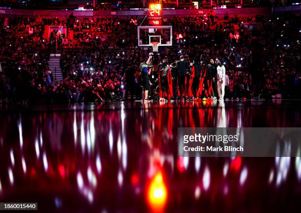 Toronto Raptors players huddle before playing the Atlanta Hawks in their basketball game at the Scotiabank Arena on December 15, 2023 in Toronto,...