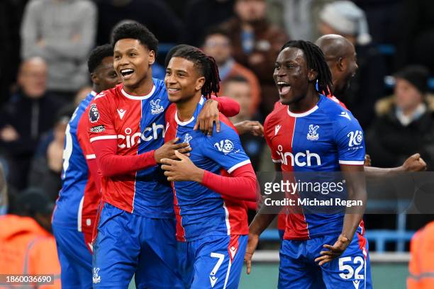 Michael Olise of Crystal Palace celebrates with teammates after scoring their team's second goal from the penalty spot during the Premier League...