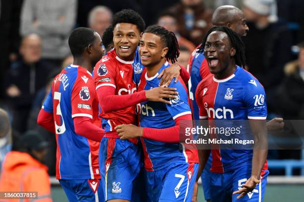 Michael Olise of Crystal Palace celebrates with teammates after scoring their team's second goal from the penalty spot during the Premier League...