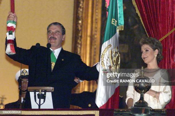 Mexican President Vicente Fox, joins his wife Marta Sahagun in celebrating the 180 year anniversary of the independence of Mexico, on the balcony of...