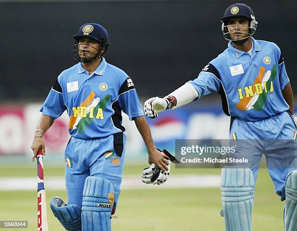 Sachin Tendulkar of India is given a pat on the back by his captain Sourav Ganguly after being dismissed for 83 during the ICC Cricket World Cup Semi...