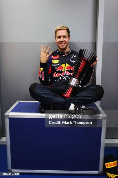 Race winner Sebastian Vettel of Germany and Infiniti Red Bull Racing celebrates his fourth consecutive F1 World Championship following the Indian...
