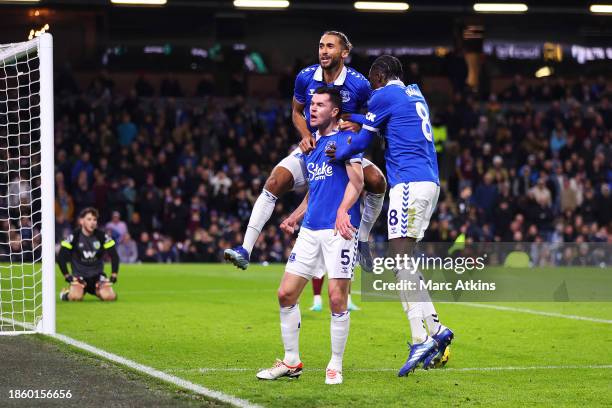 Michael Keane of Everton celebrates with teammates Dominic Calvert-Lewin and Amadou Onana after scoring their team's second goal during the Premier...