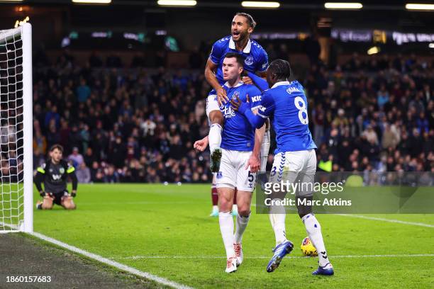 Michael Keane of Everton celebrates with teammates Dominic Calvert-Lewin and Amadou Onana after scoring their team's second goal during the Premier...