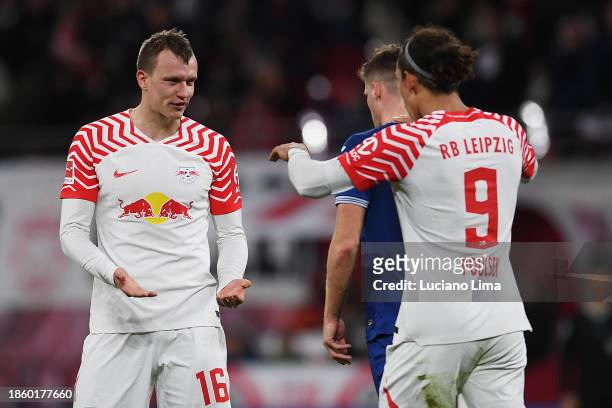 Lukas Klostermann of RB Leipzig celebrates after scoring their team's first goal with teammate Yussuf Poulsen during the Bundesliga match between RB...