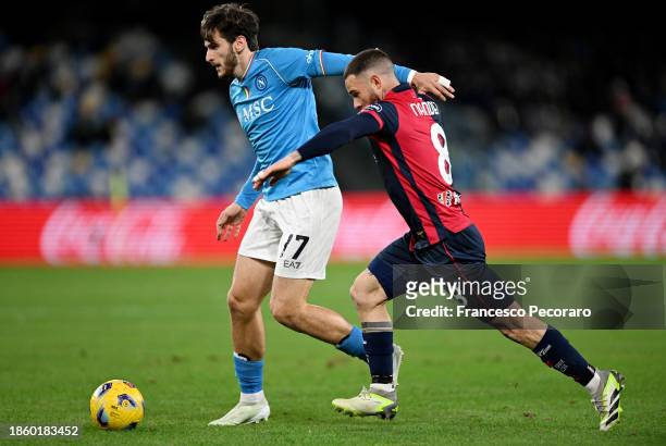 Khvicha Kvaratskhelia of SSC Napoli is put under pressure by Nahitan Nandez of Cagliari Calcio during the Serie A TIM match between SSC Napoli and...