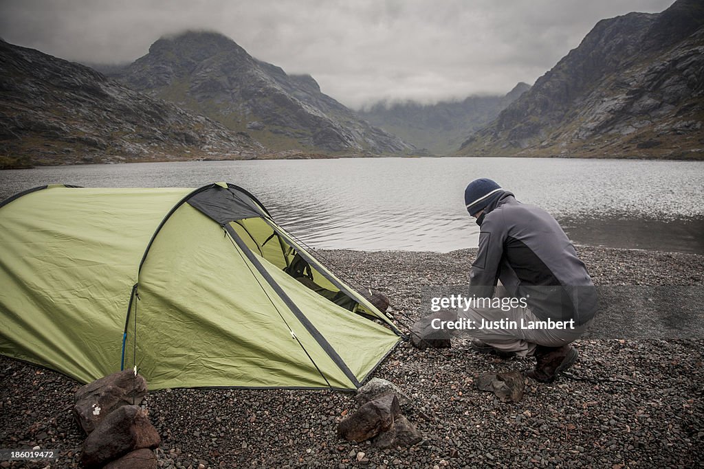MAN CAMPING ALONE IN REMOTE SPOT