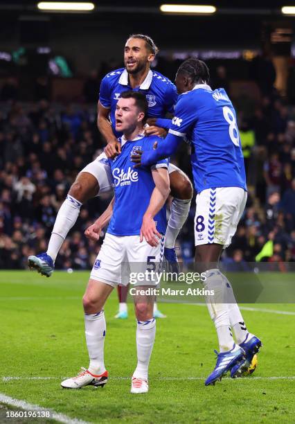 Michael Keane of Everton celebrates with teammates Dominic Calvert-Lewin and Amadou Onana after scoring their team's second goal during the Premier...