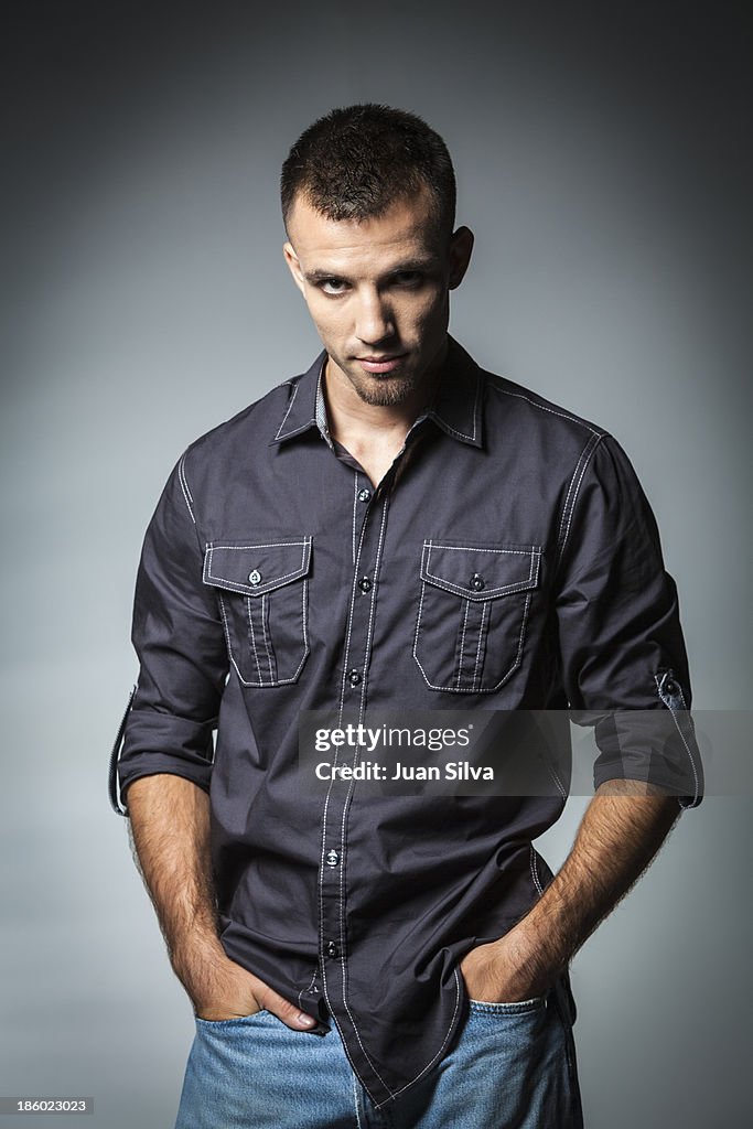 Young man in blue jeans and button down shirt