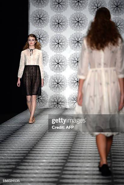 Model displays a creation by Russian designer Olga Brovkina during the Russian Fashion Week in Moscow, on October 27, 2013. The Fashion Week takes...