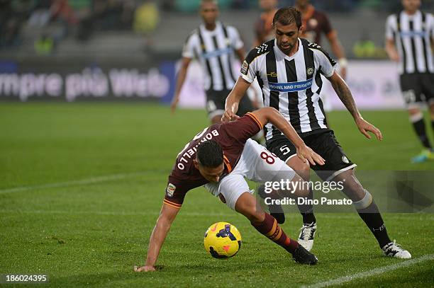 Danilo Larangeira of Udinese Calcio competes with Marco Boriello of AS Roma during the Serie A match between Udinese Calcio and AS Roma at Stadio...