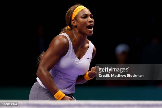 Serena Williams of the United States celebrates a point against Na Li of China during the final of the TEB BNP Paribas WTA Championships at the Sinan...