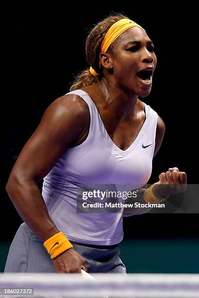 Serena Williams of the United States celebrates a point against Na Li of China during the final of the TEB BNP Paribas WTA Championships at the Sinan...