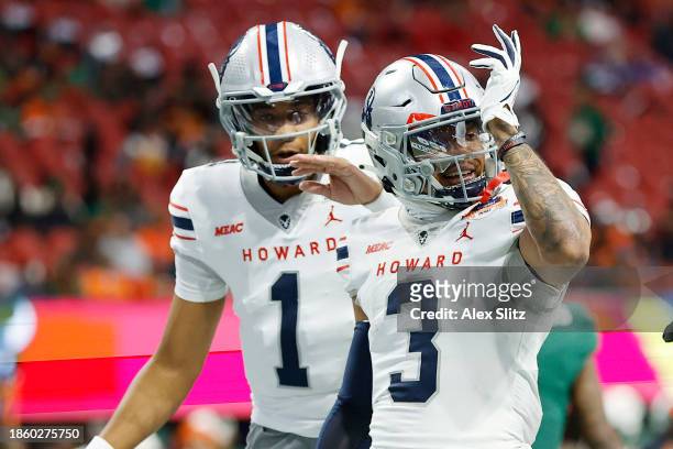 Kasey Hawthorne of the Howard Bison celebrates a touchdown with Quinton Williams of the Howard Bison against the Florida A&M Rattlers during the...