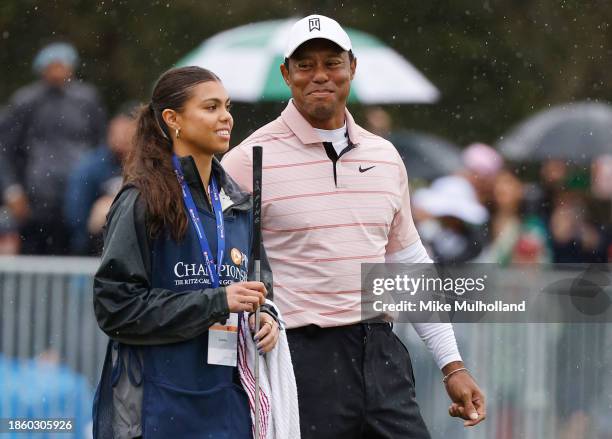 Tiger Woods of the United States looks on with daughter Sam Woods on the 18th green during the first round of the PNC Championship at The...