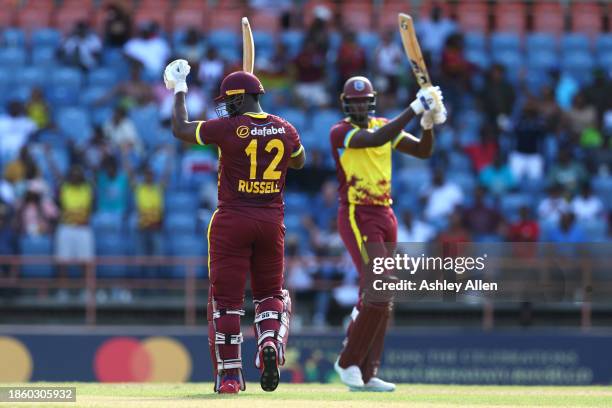 Andre Russell and Jason Holder of West Indies carry the score to 222 during the 3rd T20 International match between West Indies and England at the...