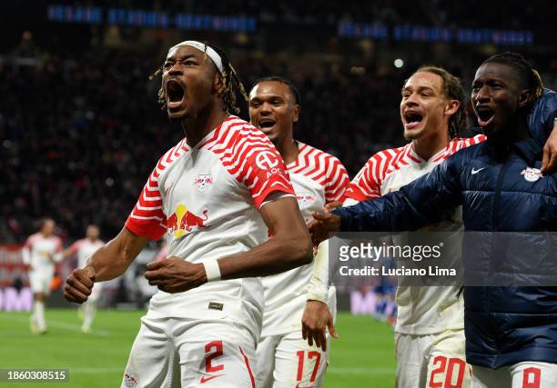 Mohamed Simakan of RB Leipzig celebrates scoring their team's third goal during the Bundesliga match between RB Leipzig and TSG Hoffenheim at Red...