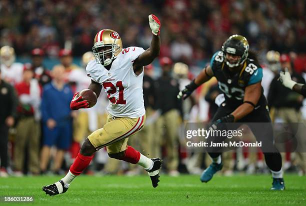 Frank Gore of the San Francisco 49ers breaks free to score a touchdown during the NFL International Series game between San Francisco 49ers and...