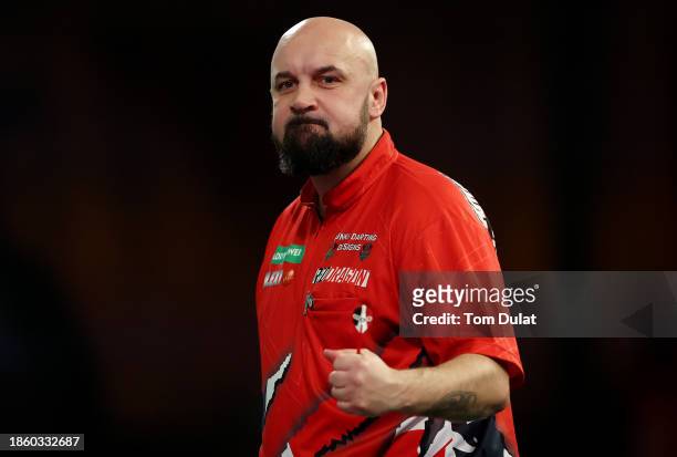 Jamie Hughes of England celebrates in his First Round match against David Cameron of Canada on Day Two of 2023/24 Paddy Power World Darts...