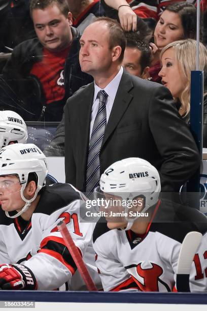 Head Coach Peter DeBoer of the New Jersey Devils watches his team play the Columbus Blue Jackets on October 22, 2013 at Nationwide Arena in Columbus,...