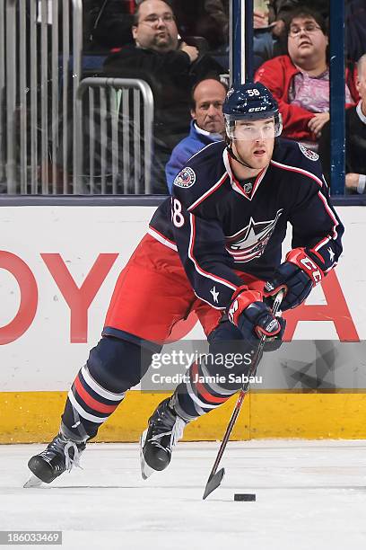 David Savard of the Columbus Blue Jackets skates with the puck against the New Jersey Devils on October 22, 2013 at Nationwide Arena in Columbus,...