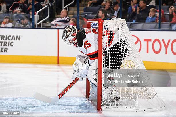 Goaltender Cory Schneider of the New Jersey Devils defends the net against the Columbus Blue Jackets on October 22, 2013 at Nationwide Arena in...