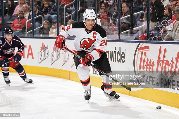 Bryce Salvador of the New Jersey Devils skates with the puck against the Columbus Blue Jackets on October 22, 2013 at Nationwide Arena in Columbus,...