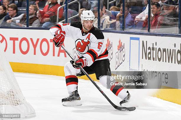 Andy Greene of the New Jersey Devils skates with the puck against the Columbus Blue Jackets on October 22, 2013 at Nationwide Arena in Columbus, Ohio.