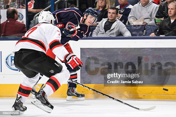 Boone Jenner of the Columbus Blue Jackets skates with the puck against the New Jersey Devils on October 22, 2013 at Nationwide Arena in Columbus,...