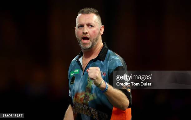 David Cameron of Canada celebrates in his First Round match against Jamie Hughes of England on Day Two of 2023/24 Paddy Power World Darts...