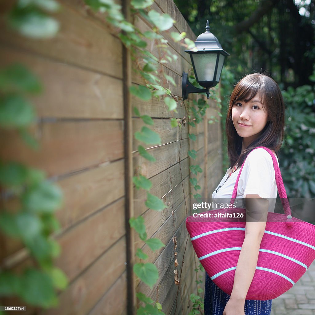 Girl with pink tote
