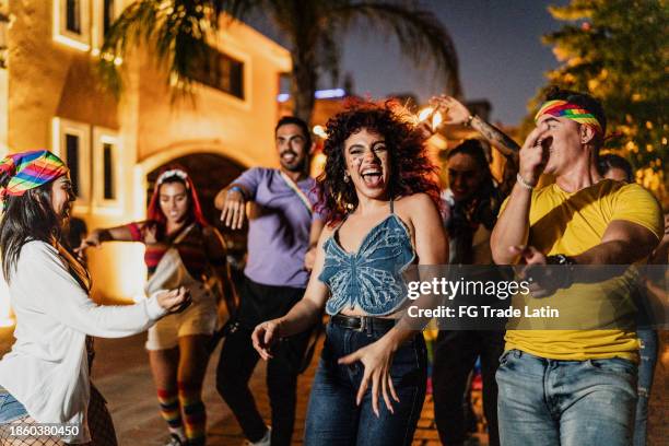 friends dancing together outdoors - street party stock pictures, royalty-free photos & images