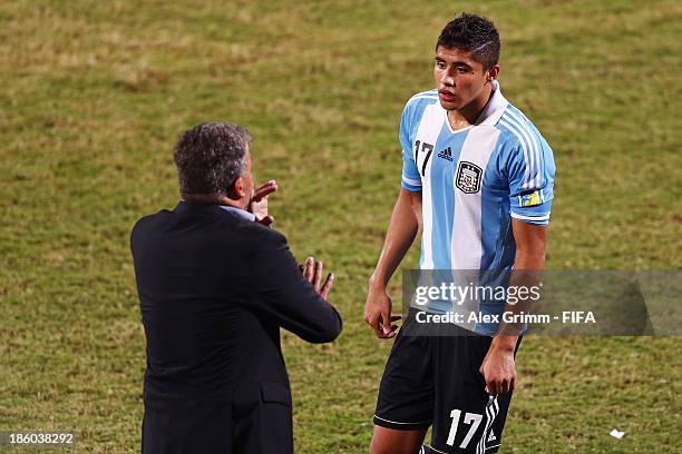 Head coach Humberto Grondona of Argentina talks to Joaquin Ibanez during the FIFA U-17 World Cup UAE 2013 Group E match between Argentina and Canada...