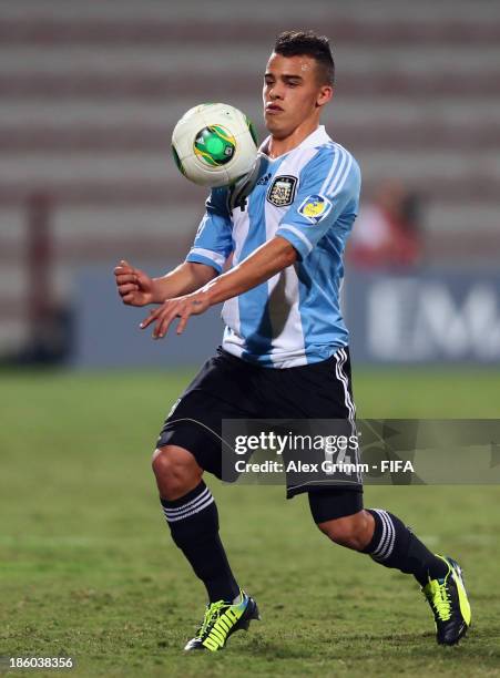 Lucio Compagnucci of Argentina controles the ball during the FIFA U-17 World Cup UAE 2013 Group E match between Argentina and Canada at Al Rashid...