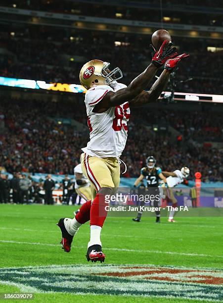 Vernon Davis of the San Francisco 49ers scores a touchdown during the NFL International Series game between San Francisco 49ers and Jacksonville...