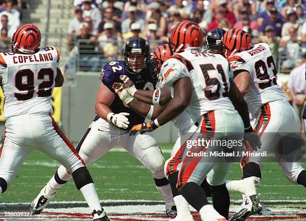 Right Guard Mike Flynn of the Baltimore Ravens blocks several Linemen of the Cincinnati Bengals during a NFL game at PSINet Stadium on September 24,...