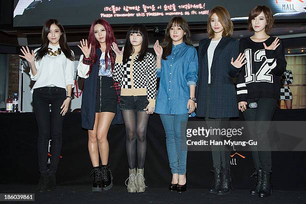 Members of South Korean girl group T-ara pose for media at their 8th Mini Album 'Again' record release signing at IFC Mall on October 27, 2013 in...