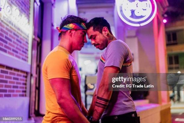 gay couple face to face outdoors - anti racism stock pictures, royalty-free photos & images