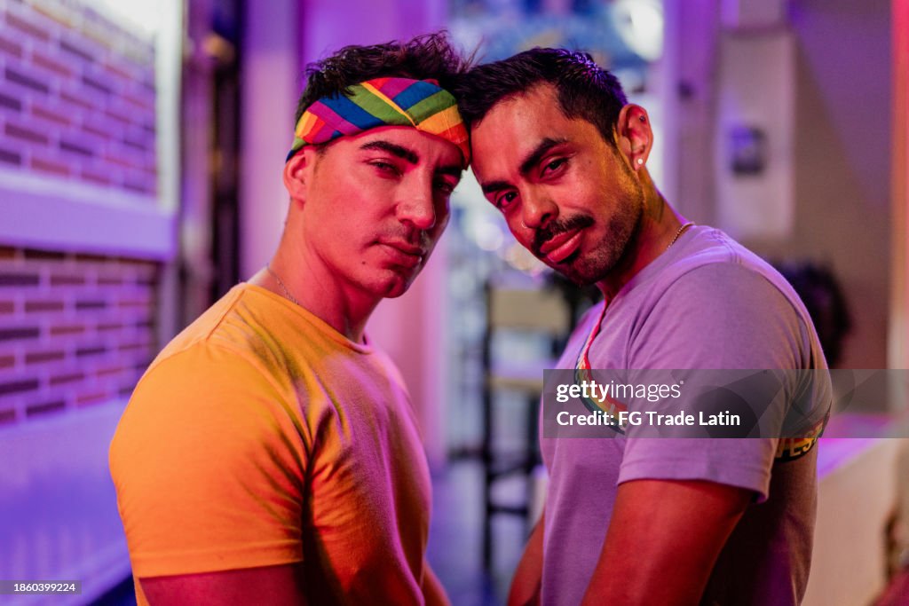 Portrait of a gay couple in a night club